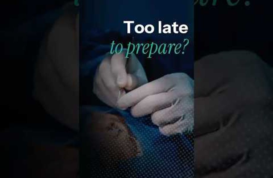 Close-up of a surgeon's gloved hands preparing for cataract surgery