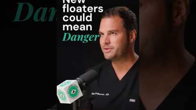Male ophthalmologist discussing warning signs of new eye floaters after cataract surgery
