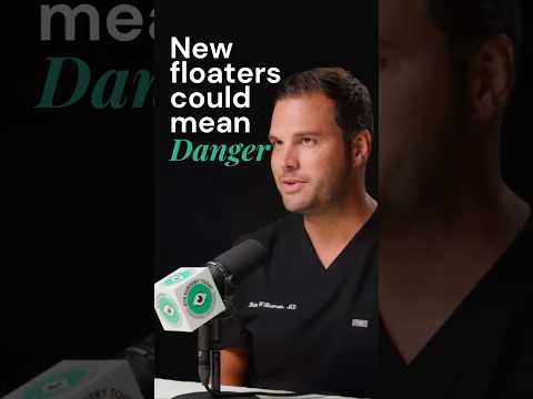 Male ophthalmologist discussing warning signs of new eye floaters after cataract surgery